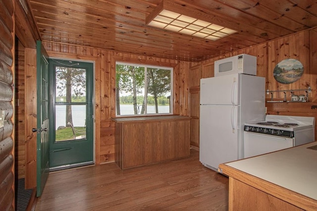 1378 Sunflower Trl NE, Outing, MN 56662 - kitchen featuring white appliances, wood ceiling, wooden walls, and light wood-style floors