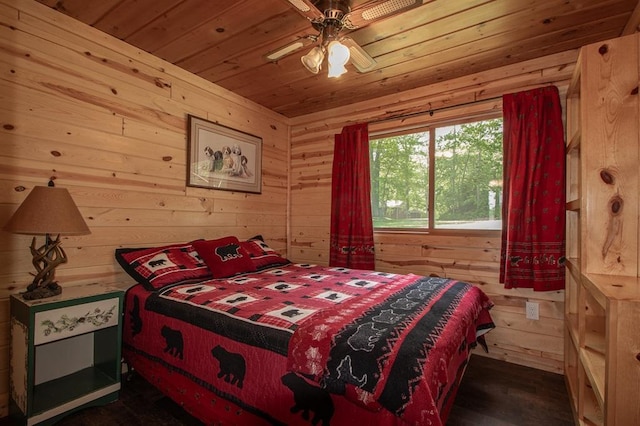 1378 Sunflower Trl NE, Outing, MN 56662 - bedroom with wooden ceiling, wooden walls, dark wood-type flooring, and a ceiling fan