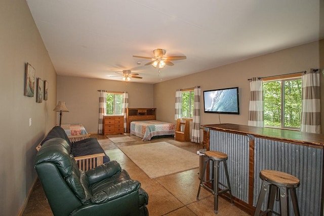 1378 Sunflower Trl NE, Outing, MN 56662 - bedroom featuring multiple windows, a bar, and baseboards