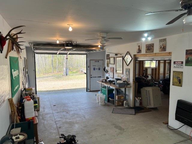 1378 Sunflower Trl NE, Outing, MN 56662 - garage with ceiling fan and a garage door opener