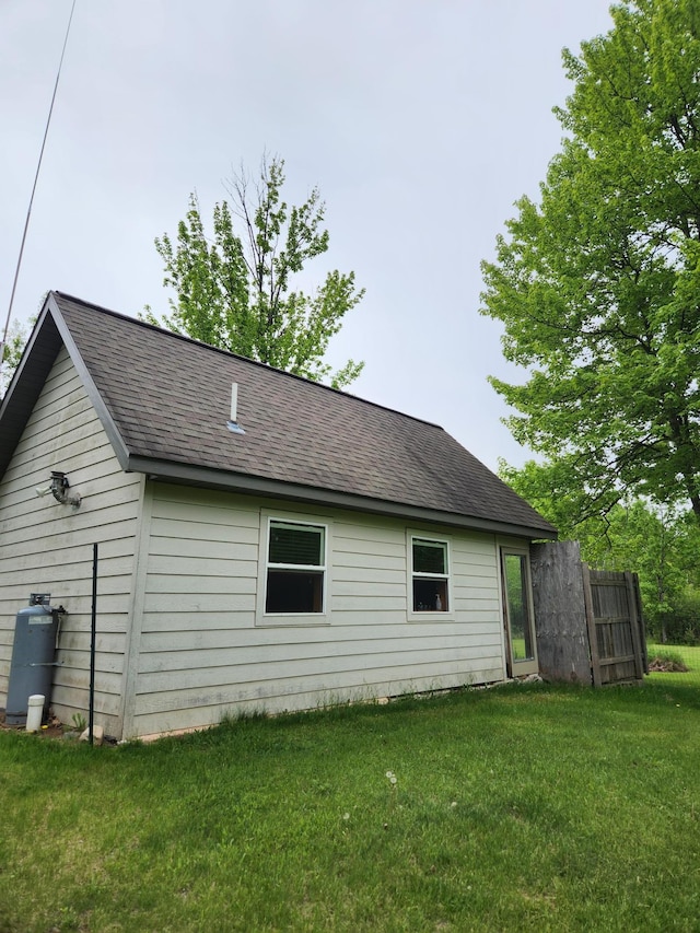35270 Bear Creek Rd, Partridge Twp, MN 55704 - view of side of property featuring a lawn and roof with shingles