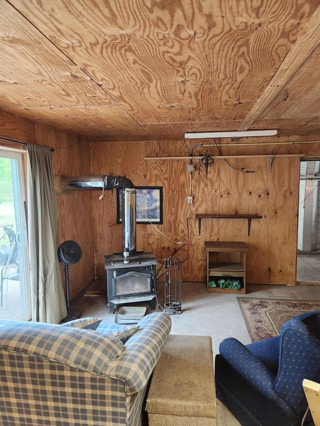 35270 Bear Creek Rd, Partridge Twp, MN 55704 - living area with wood walls and a wood stove