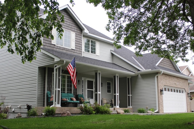 4860 Mason Ave NE, Saint Michael, MN 55376 - view of front of property with a porch, an attached garage, roof with shingles, and a front lawn