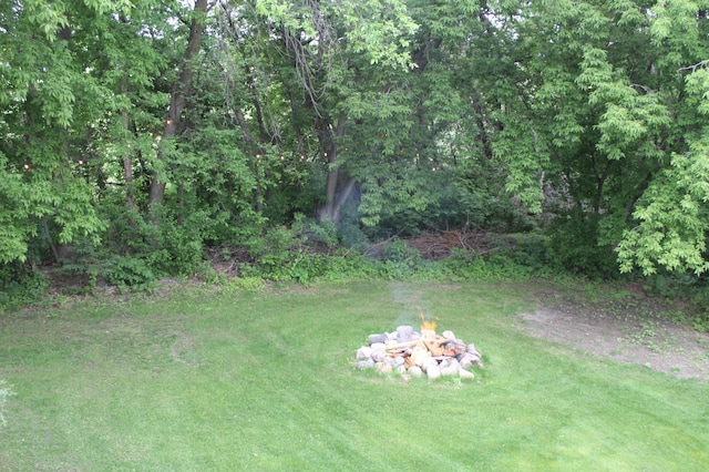 4860 Mason Ave NE, Saint Michael, MN 55376 - view of green lawn featuring an outdoor fire pit