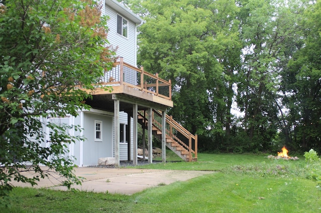 4860 Mason Ave NE, Saint Michael, MN 55376 - view of grassy yard with a deck, stairs, and a fire pit
