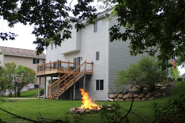 4860 Mason Ave NE, Saint Michael, MN 55376 - rear view of property with stairs, a fire pit, a wooden deck, and a yard