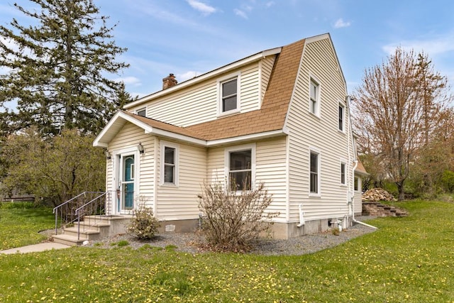 4031 Regent St, Duluth, MN 55804 - colonial inspired home with a shingled roof, a front lawn, a chimney, and a gambrel roof