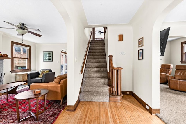 4031 Regent St, Duluth, MN 55804 - stairs featuring ceiling fan, baseboards, and arched walkways
