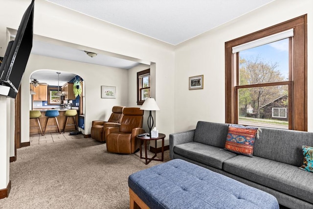 4031 Regent St, Duluth, MN 55804 - living area with light colored carpet, arched walkways, and baseboards