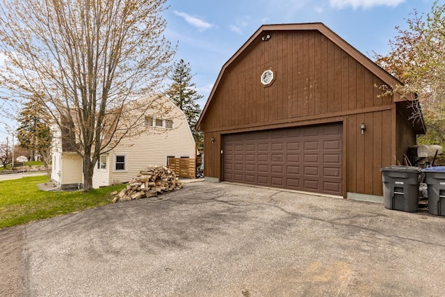 4031 Regent St, Duluth, MN 55804 - view of property exterior with a garage, an outbuilding, and a gambrel roof