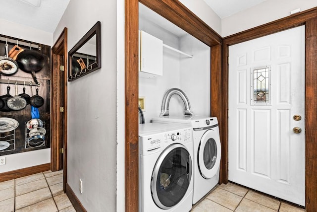 4031 Regent St, Duluth, MN 55804 - washroom with light tile patterned floors and washing machine and clothes dryer