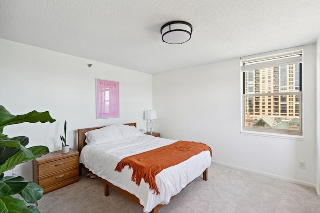 401 1st St Unit 922, Minneapolis, MN 55401 - bedroom featuring carpet, a textured ceiling, and baseboards