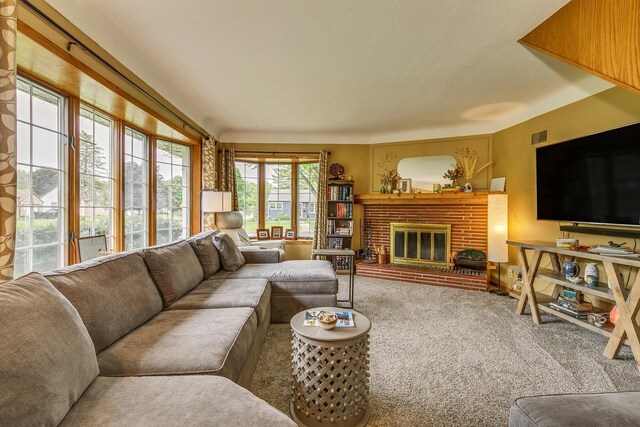 2816 29th Ave NE, Saint Anthony, MN 55418 - living room featuring carpet floors and a brick fireplace