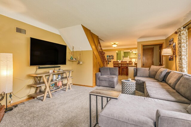 2816 29th Ave NE, Saint Anthony, MN 55418 - carpeted living room with baseboards and stairway