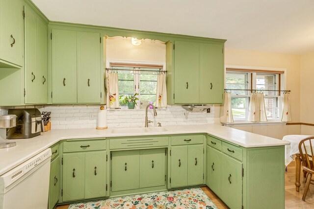 2816 29th Ave NE, Saint Anthony, MN 55418 - kitchen with dishwasher, a sink, tasteful backsplash, and healthy amount of natural light