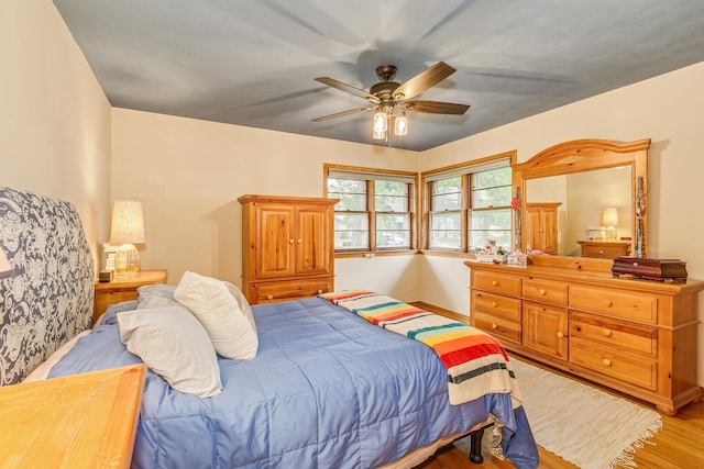 2816 29th Ave NE, Saint Anthony, MN 55418 - bedroom featuring light wood-style flooring, ceiling fan, and baseboards
