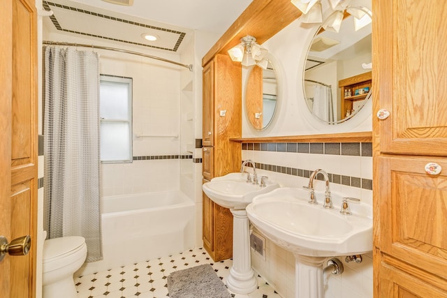 2816 29th Ave NE, Saint Anthony, MN 55418 - full bathroom featuring toilet, shower / tub combo, and a sink