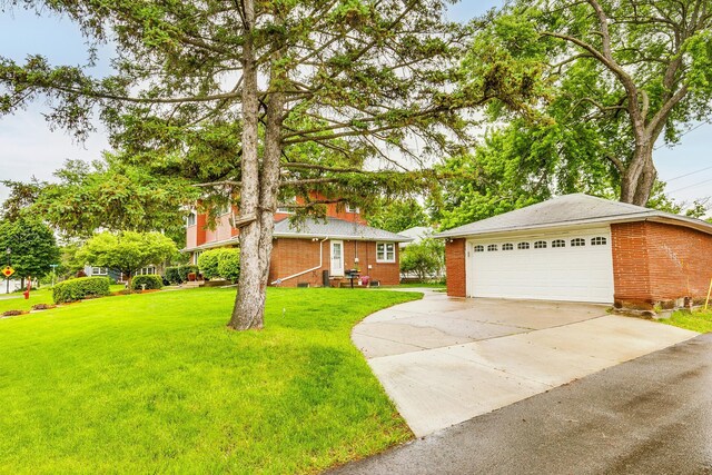 2816 29th Ave NE, Saint Anthony, MN 55418 - view of front of property featuring brick siding, a detached garage, and a front yard
