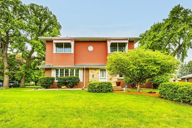 2816 29th Ave NE, Saint Anthony, MN 55418 - view of front facade with a front yard and brick siding