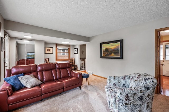 5404 Welcome Ave N, Crystal, MN 55429 - carpeted living area featuring a textured ceiling and baseboards