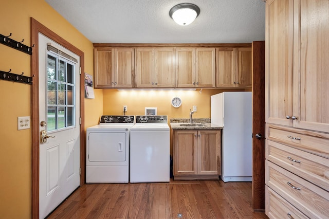 5404 Welcome Ave N, Crystal, MN 55429 - laundry room with cabinet space, washing machine and dryer, dark wood finished floors, and a textured ceiling