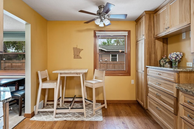 5404 Welcome Ave N, Crystal, MN 55429 - dining space featuring light wood-style flooring, baseboards, and ceiling fan