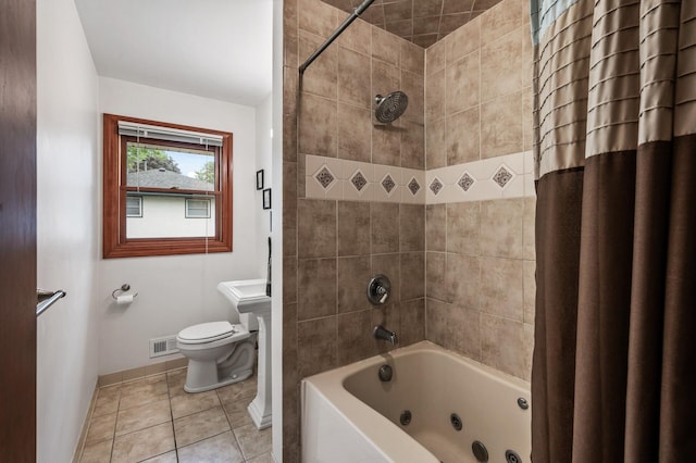 5404 Welcome Ave N, Crystal, MN 55429 - bathroom with toilet, baseboards, a combined bath / shower with jetted tub, and tile patterned flooring
