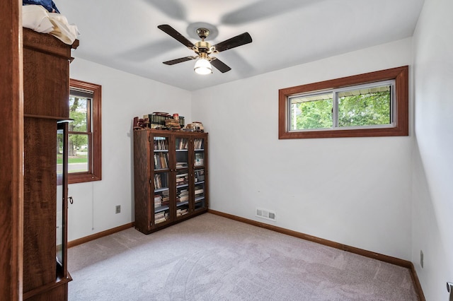 5404 Welcome Ave N, Crystal, MN 55429 - carpeted empty room featuring plenty of natural light, baseboards, and a ceiling fan