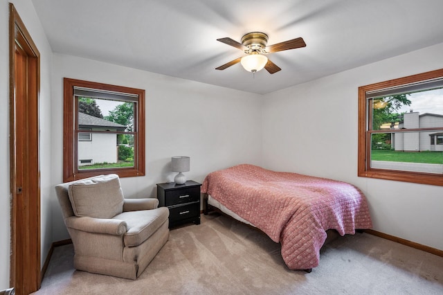 5404 Welcome Ave N, Crystal, MN 55429 - bedroom with light colored carpet, baseboards, and ceiling fan