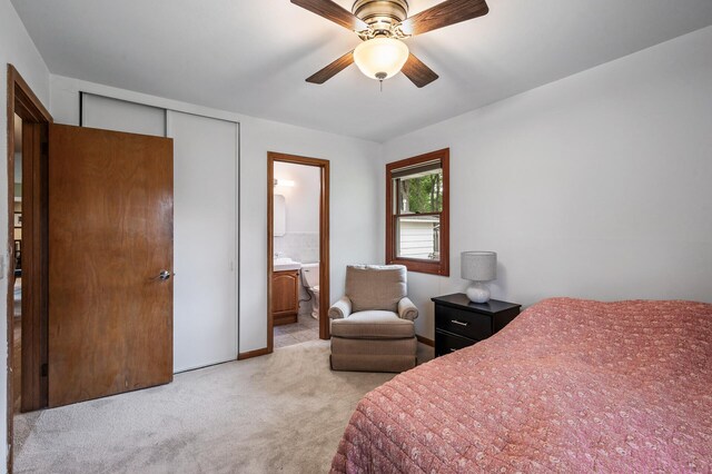 5404 Welcome Ave N, Crystal, MN 55429 - bedroom featuring light colored carpet, ensuite bath, and a ceiling fan