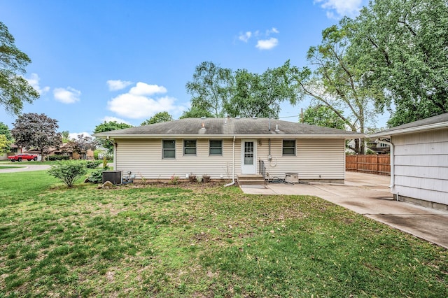 5404 Welcome Ave N, Crystal, MN 55429 - back of house with entry steps, central AC, and a patio