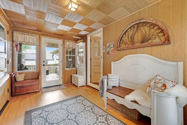4600 3rd St NE, Fridley, MN 55421 - sitting room featuring wood walls, wooden ceiling, and light wood-type flooring
