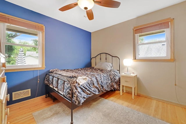 4600 3rd St NE, Fridley, MN 55421 - bedroom featuring wood finished floors and a ceiling fan