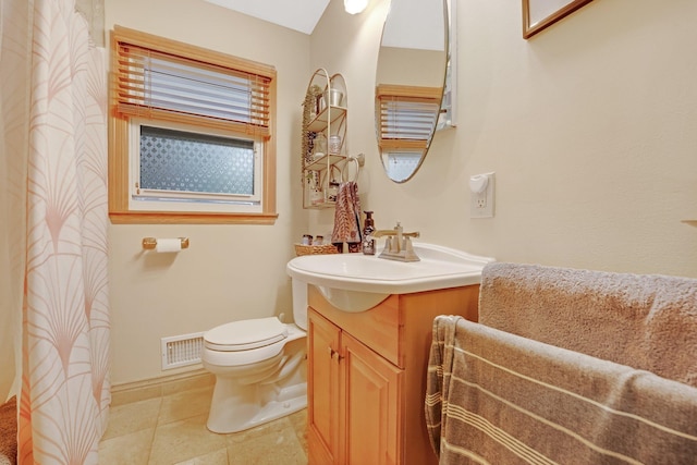 4600 3rd St NE, Fridley, MN 55421 - full bathroom featuring vanity, tile patterned floors, and curtained shower