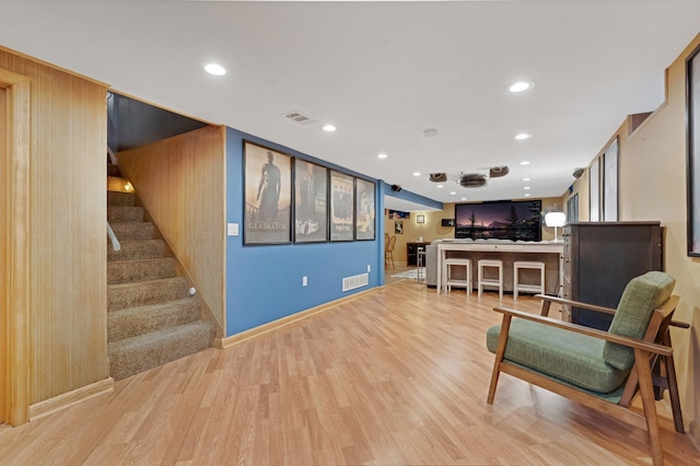 4600 3rd St NE, Fridley, MN 55421 - sitting room with wood finished floors, stairs, and recessed lighting