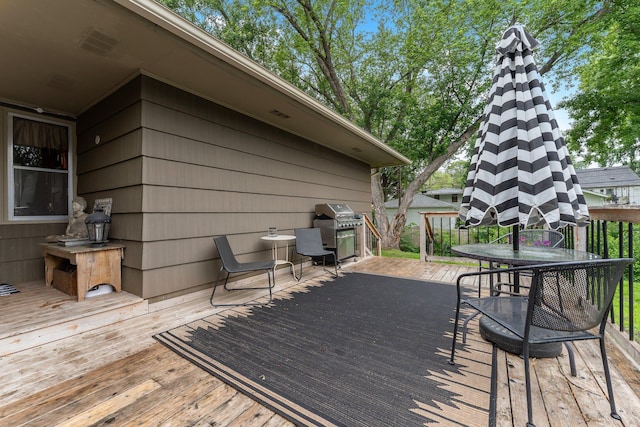 4600 3rd St NE, Fridley, MN 55421 - wooden terrace featuring grilling area and outdoor dining area