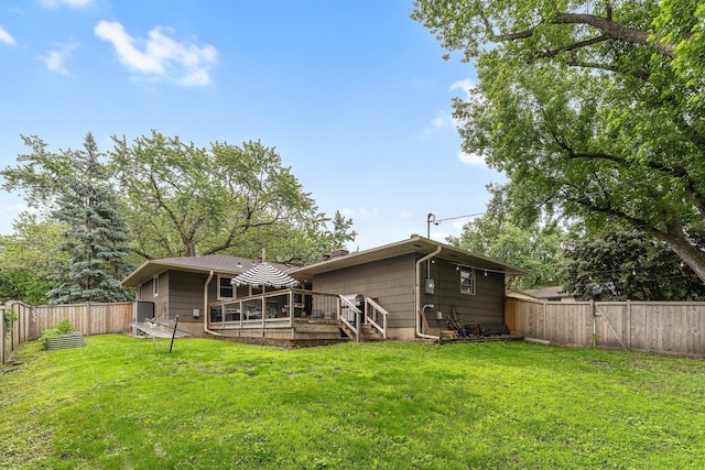 4600 3rd St NE, Fridley, MN 55421 - back of house featuring a fenced backyard and a deck