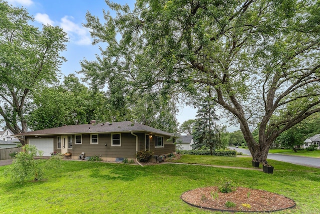 4600 3rd St NE, Fridley, MN 55421 - ranch-style house featuring a garage, a front lawn, and driveway