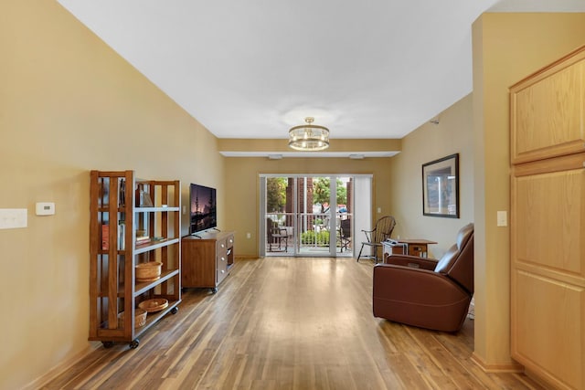 16154 Main Ave SE # 120, Prior Lake, MN 55372 - living area featuring light wood finished floors and a chandelier