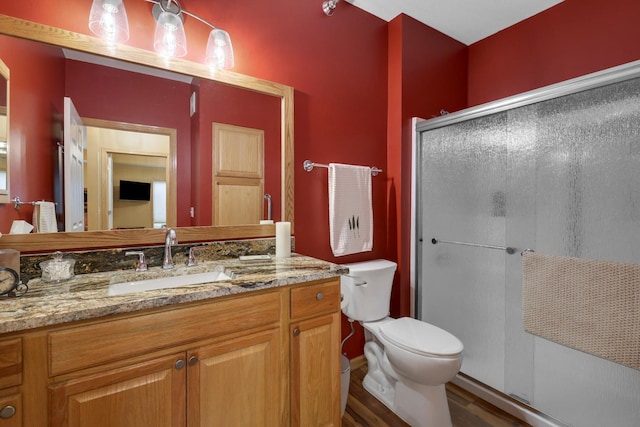 16154 Main Ave SE # 120, Prior Lake, MN 55372 - full bath with a stall shower, vanity, toilet, and wood finished floors