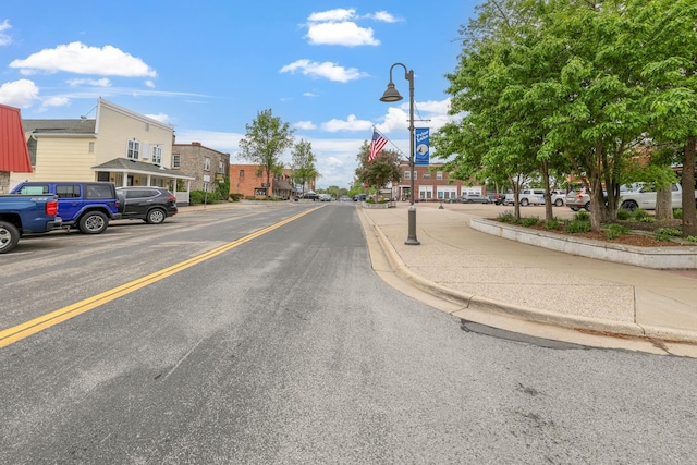 16154 Main Ave SE # 120, Prior Lake, MN 55372 - view of asphalt road featuring curbs, street lighting, a residential view, and sidewalks