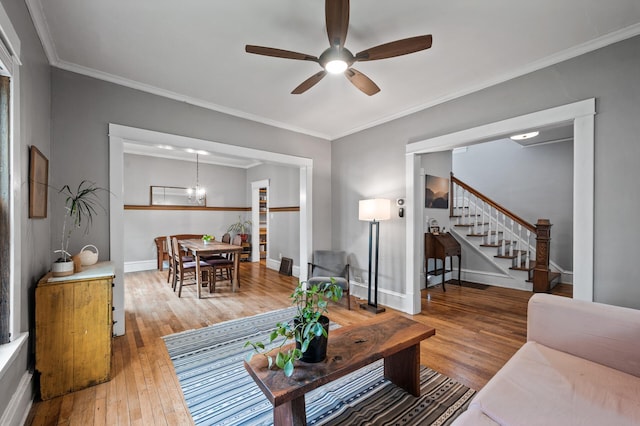 4312 Nokomis Ave, Minneapolis, MN 55406 - living area with a ceiling fan, hardwood / wood-style flooring, stairs, crown molding, and baseboards