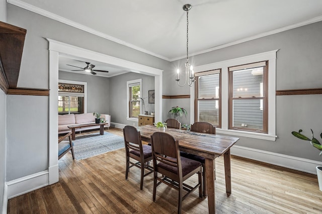 4312 Nokomis Ave, Minneapolis, MN 55406 - dining room featuring hardwood / wood-style floors, baseboards, ornamental molding, a chandelier, and a ceiling fan