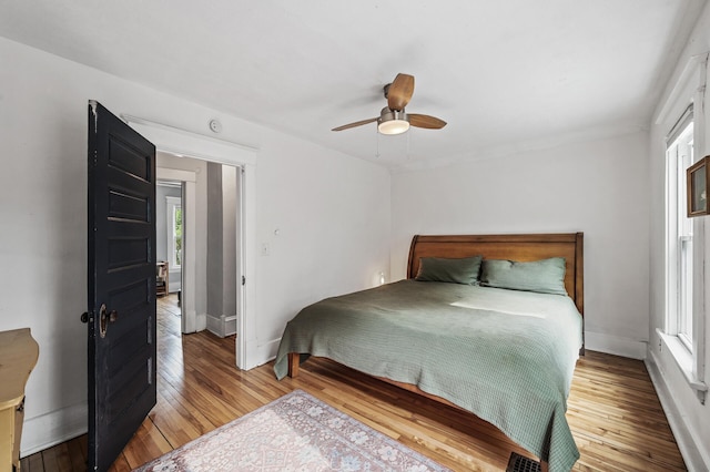 4312 Nokomis Ave, Minneapolis, MN 55406 - bedroom with multiple windows, hardwood / wood-style floors, and baseboards