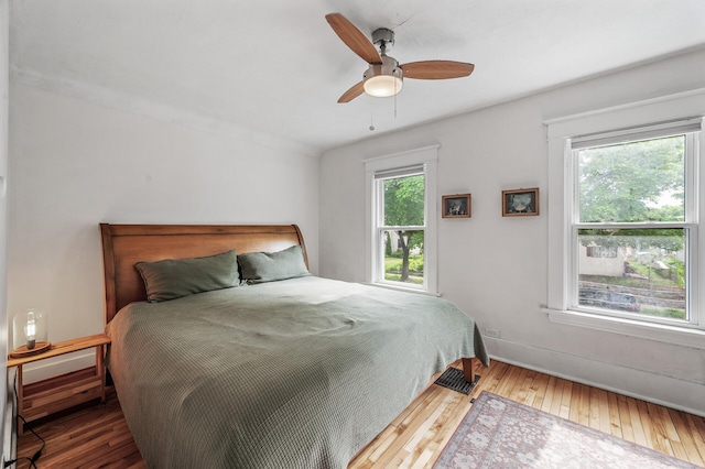 4312 Nokomis Ave, Minneapolis, MN 55406 - bedroom with hardwood / wood-style flooring, a ceiling fan, and baseboards