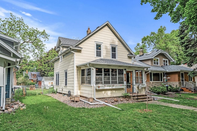 4312 Nokomis Ave, Minneapolis, MN 55406 - view of front of property featuring a chimney, a shingled roof, and a sunroom