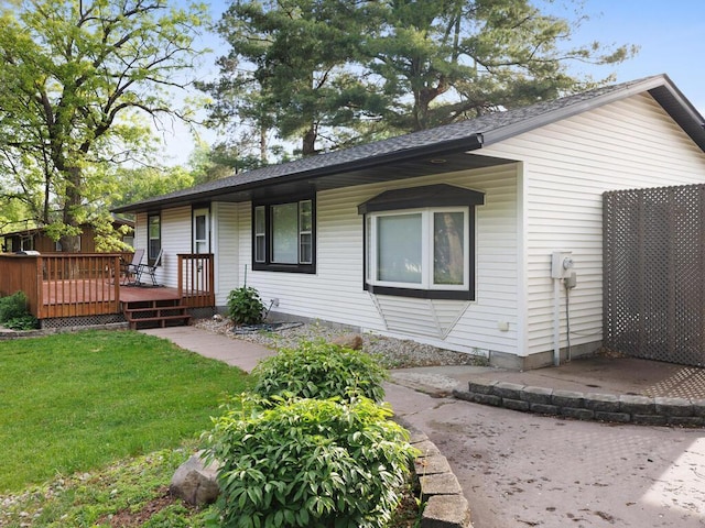 38609 Branch Ave, North Branch, MN 55056 - rear view of house with a yard, a deck, and a shingled roof