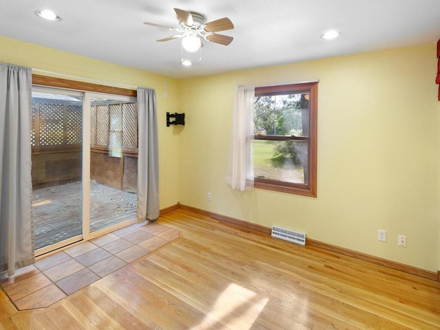 38609 Branch Ave, North Branch, MN 55056 - unfurnished room with ceiling fan, wood finished floors, baseboards, and recessed lighting