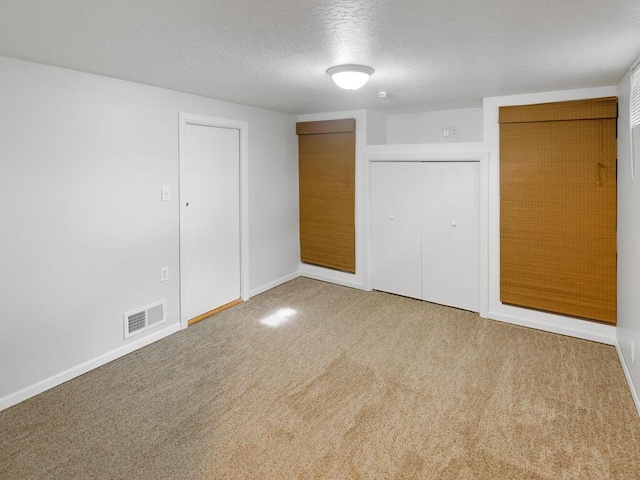 38609 Branch Ave, North Branch, MN 55056 - unfurnished bedroom featuring a textured ceiling, carpet flooring, and baseboards