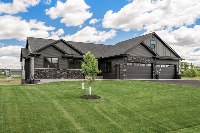 18885 Poppy St NW, Oak Grove, MN 55303 - craftsman-style home featuring board and batten siding, an attached garage, a front yard, and stone siding